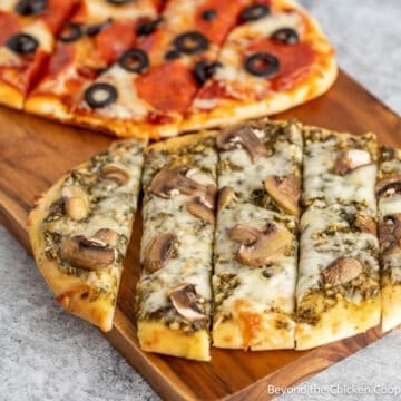 Baked Flatbread Pizza topped with mushrooms, pepperoni, and olives.