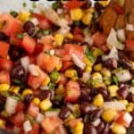 A bowl filled with black bean and corn salsa.