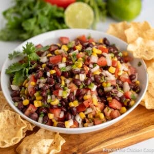 Black Bean Salsa with corn and tomatoes in a white bowl.