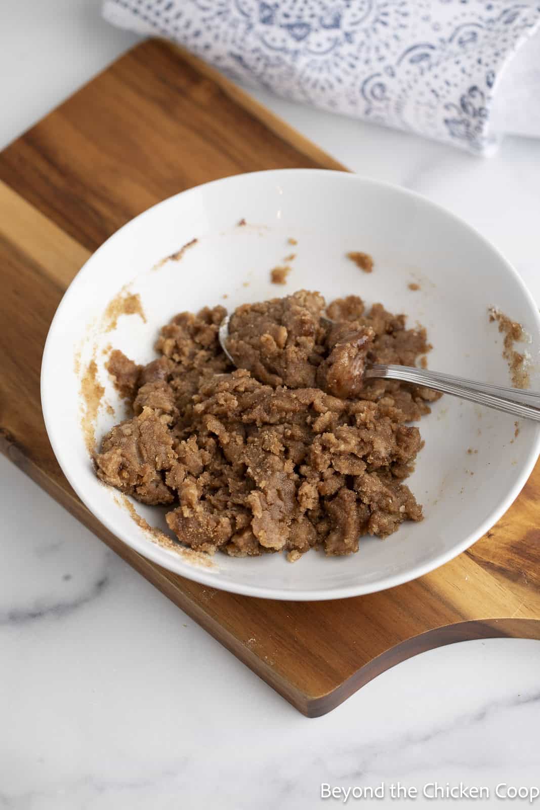 Crumble topping in a white bowl. 