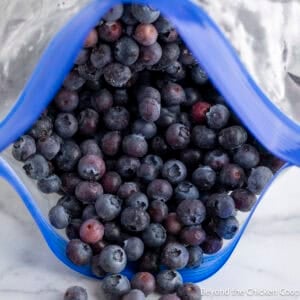A freeze bag filled with frozen blueberries.