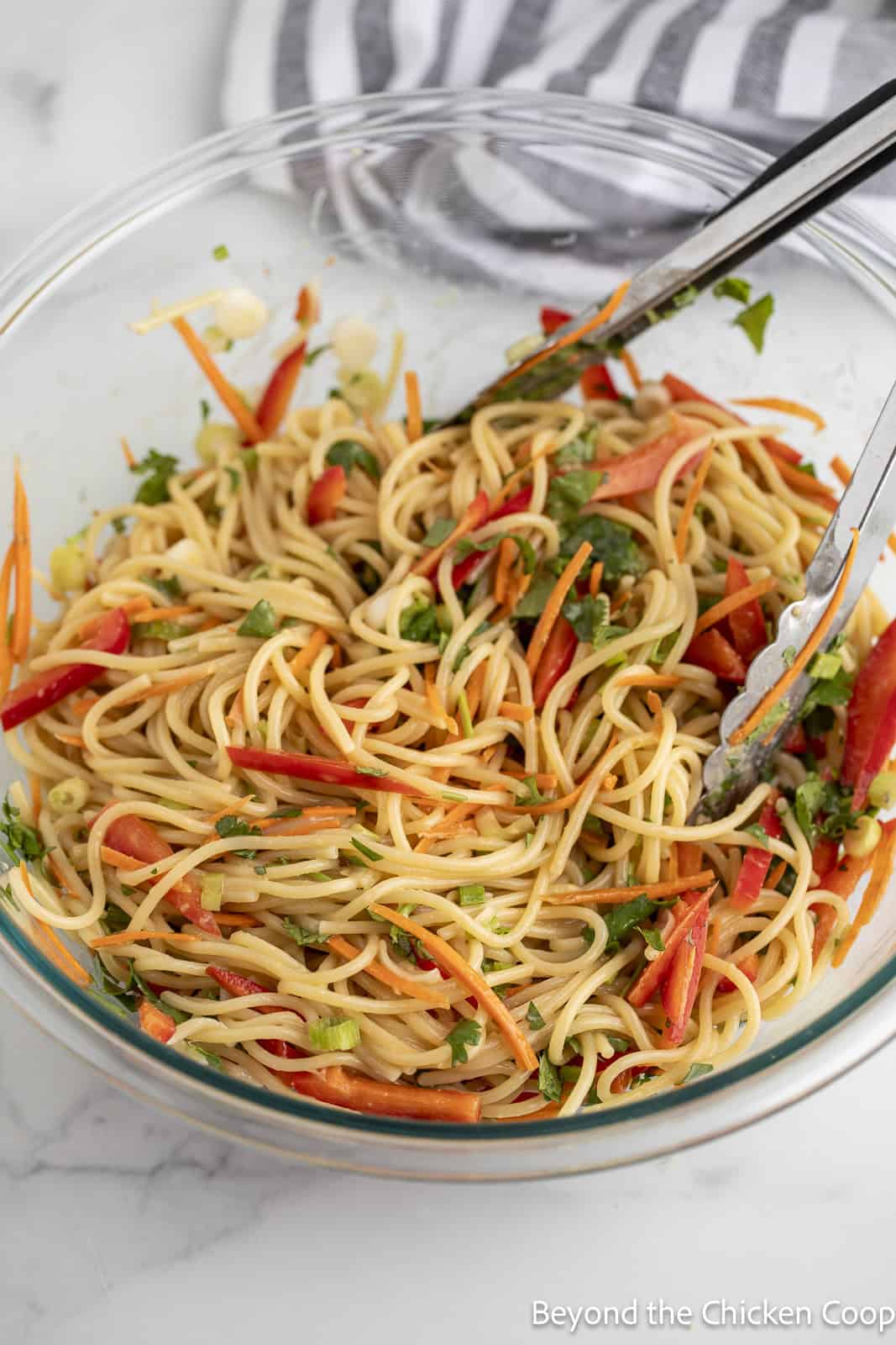 Pasta salad in a glass bowl.