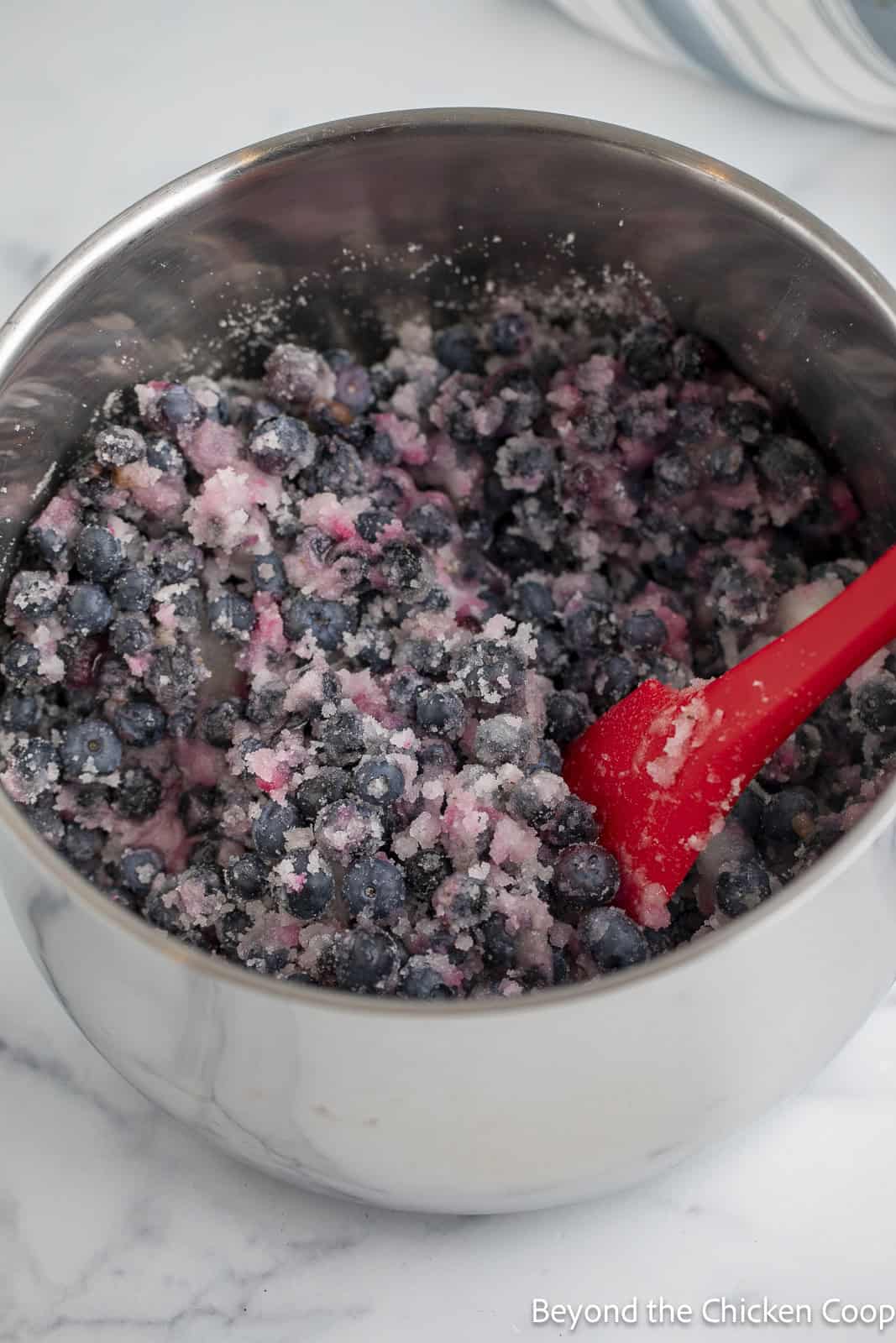 Blueberries and sugar in a large pot. 