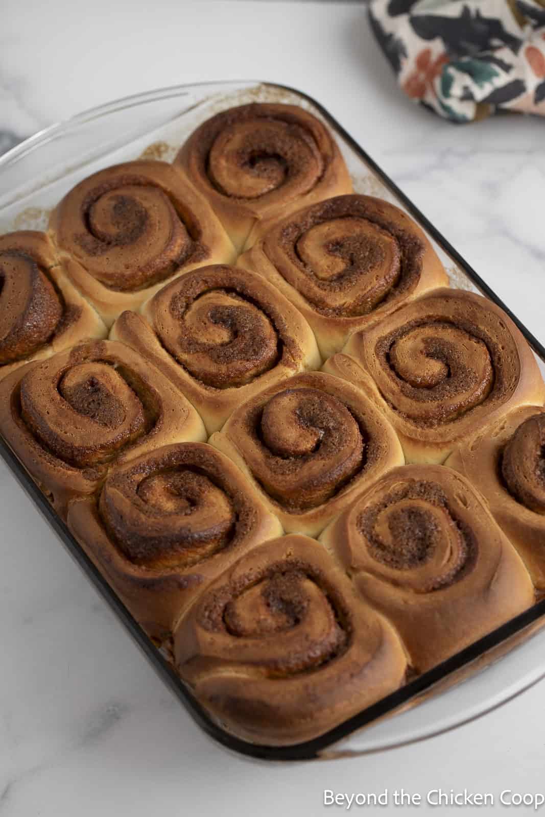 Fully baked cinnamon rolls in a pan. 