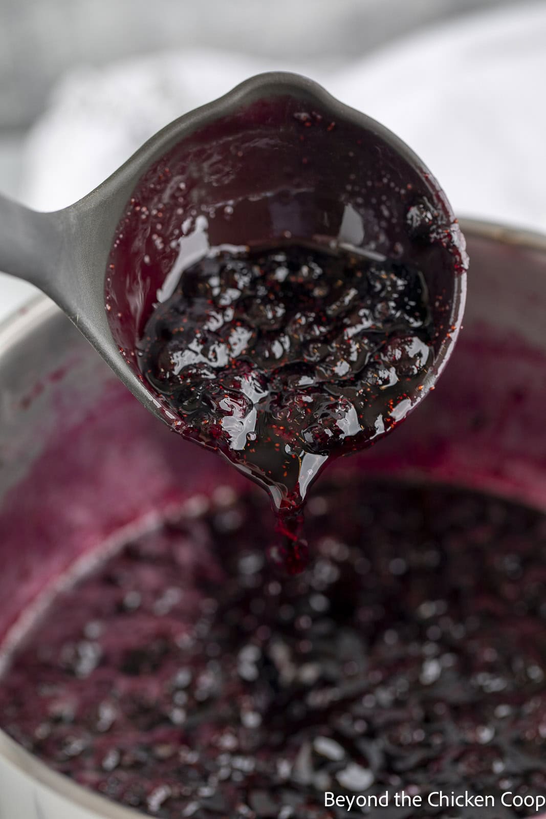 Jam with blueberries in a pot. 