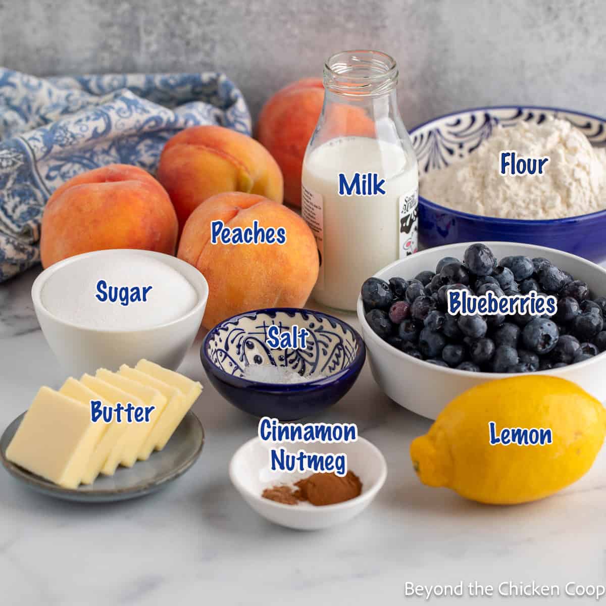 Ingredients needed for making a peach and blueberry cobbler. 