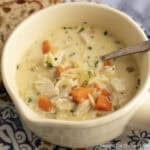 Creamy Chicken Orzo Soup in a soup mug.
