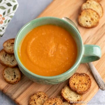 Carrot Ginger Soup in a green mug.