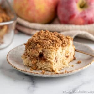 A slice of Apple Coffee Cake on a small plate.