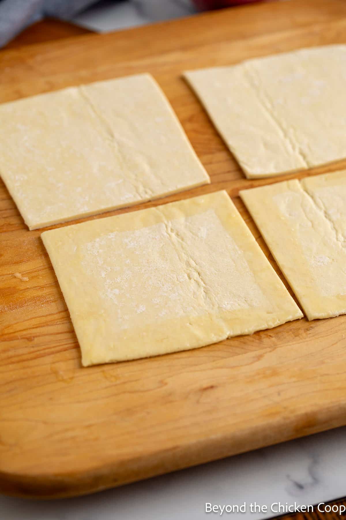 Puff pastry cut into squares and brushed with egg wash.