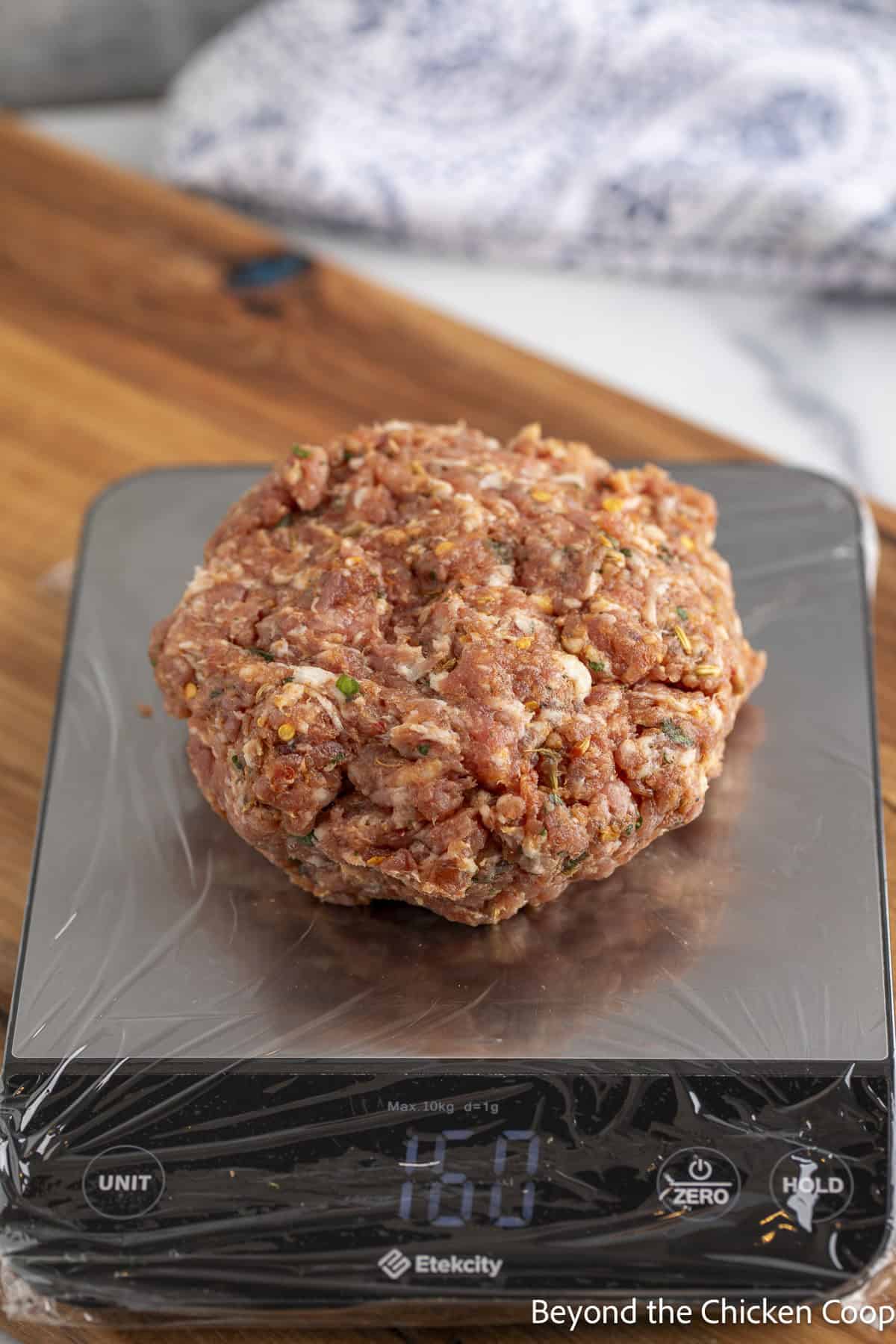 Weighing out sausage patties. 