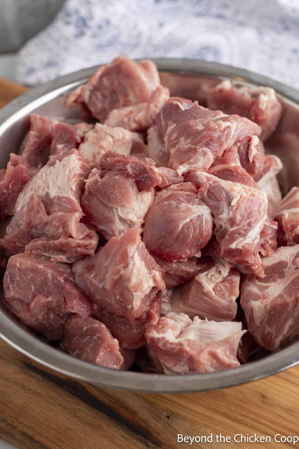 Pork shoulder cut into large cubes. 