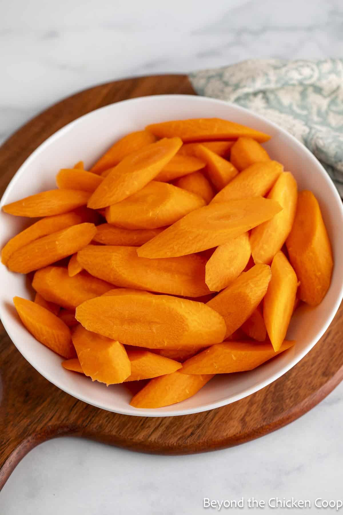 A bowl filled with cut carrots.