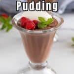 Chocolate pudding topped with whipped cream and fresh raspberries.