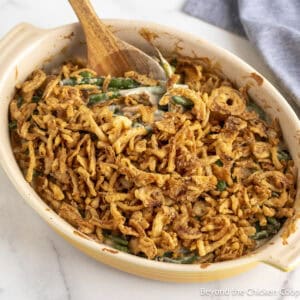 Homemade Green Bean Casserole in a yellow baking dish.