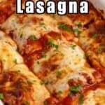 A lasagna casserole topped with freshly chopped parsley.