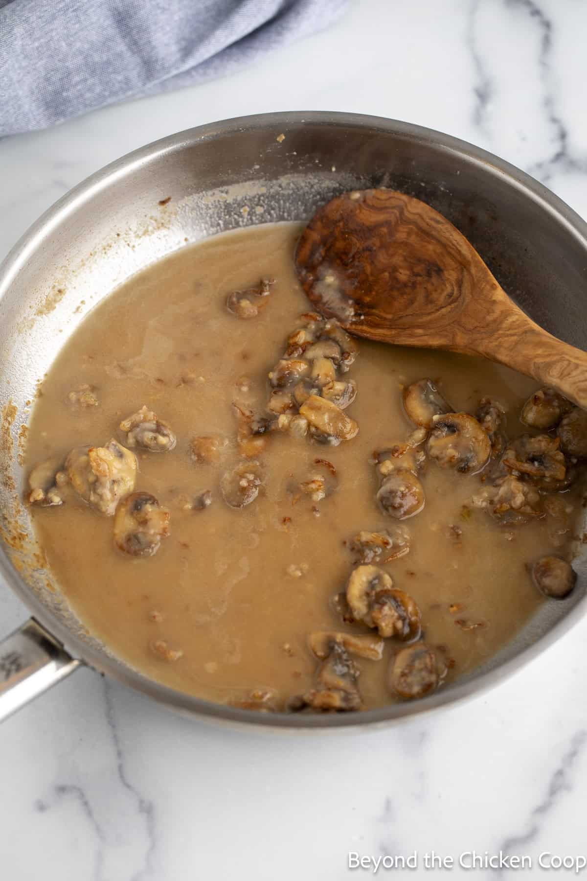 Making a sauce in a large pan.