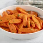 A dish filled with Maple Glazed Carrots.