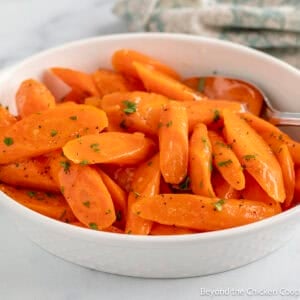A dish filled with Maple Glazed Carrots.