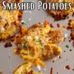 Smashed potatoes topped with cheese and parsley.