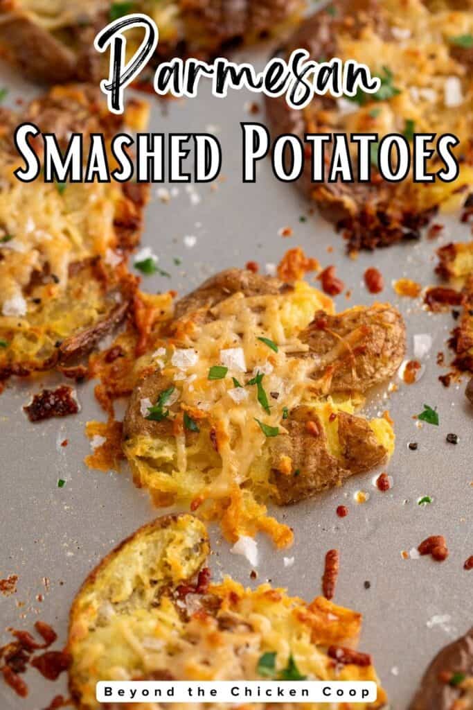 Smashed potatoes topped with cheese and parsley.