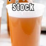 Homemade veggie stock in a freezer container.