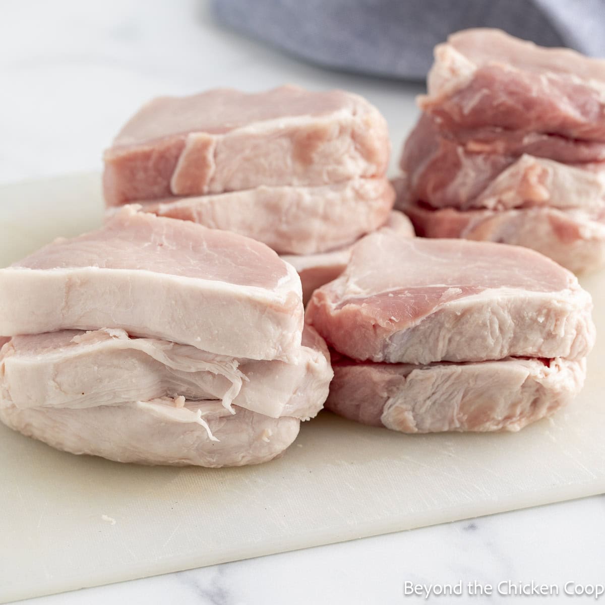 Sliced pork loin chops on a cutting board.