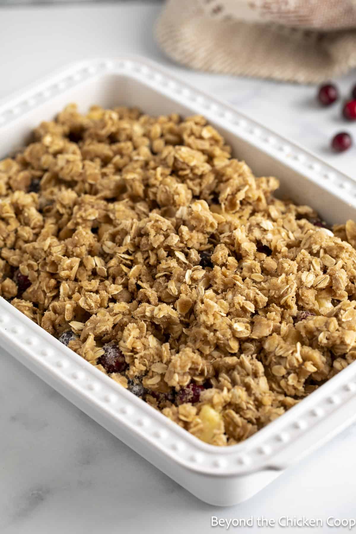 Oatmeal topping covering a fruit dessert.