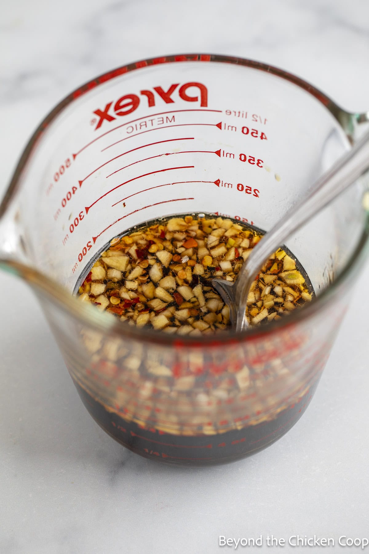Honey soy sauce in a measuring cup.