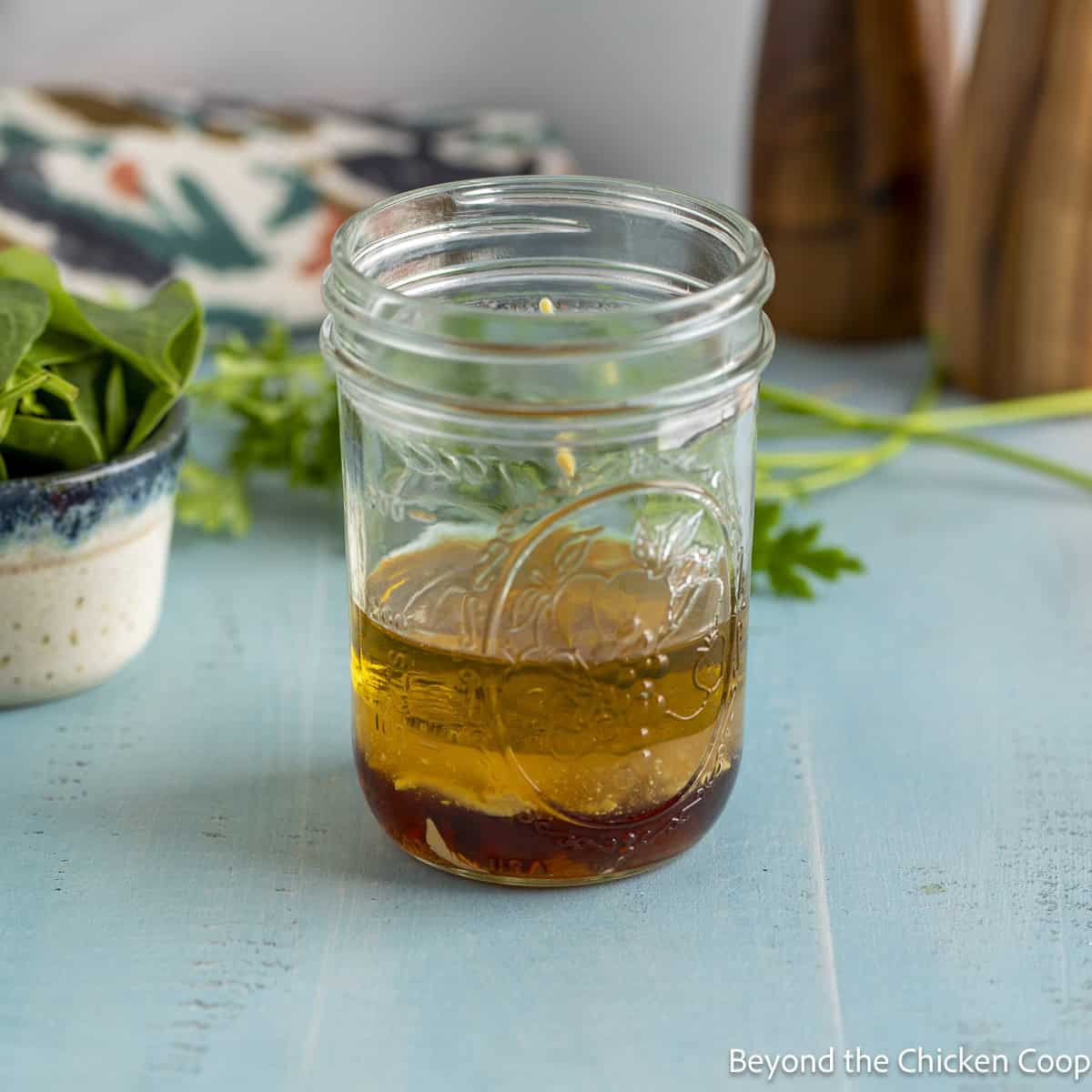 A maple dressing in a glass jar.