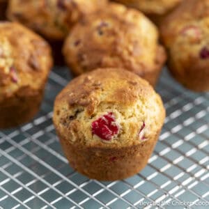 Cranberry Nut Muffins on a baking rack.