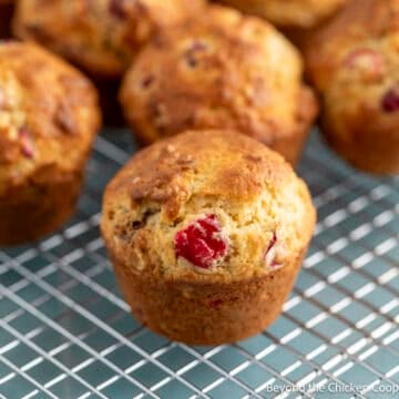Cranberry Nut Muffins on a baking rack.