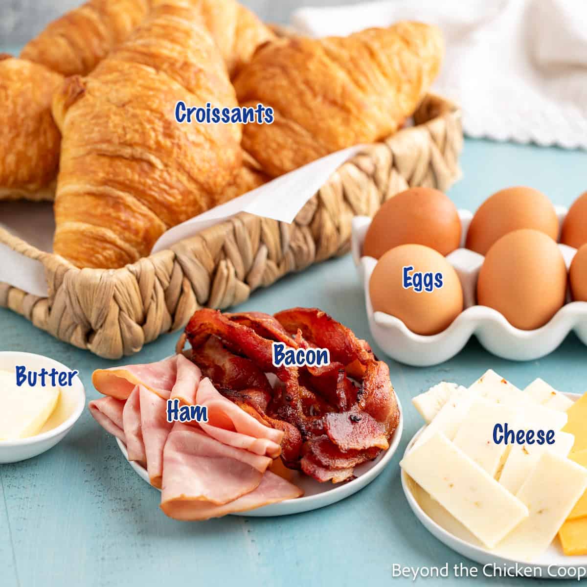 Croissants, egg, cheese, bacon, and ham.