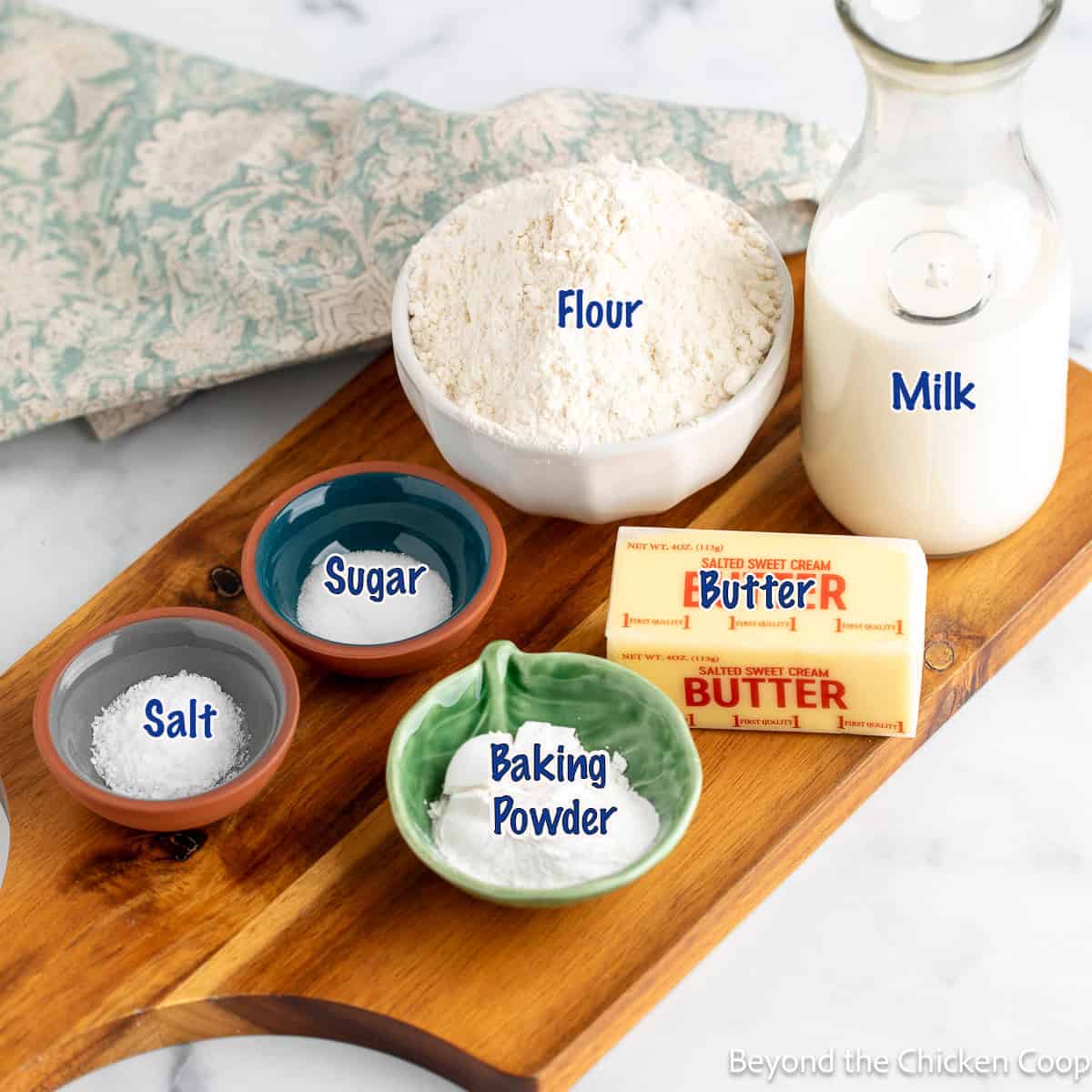 Ingredients for making biscuits in small bowls.
