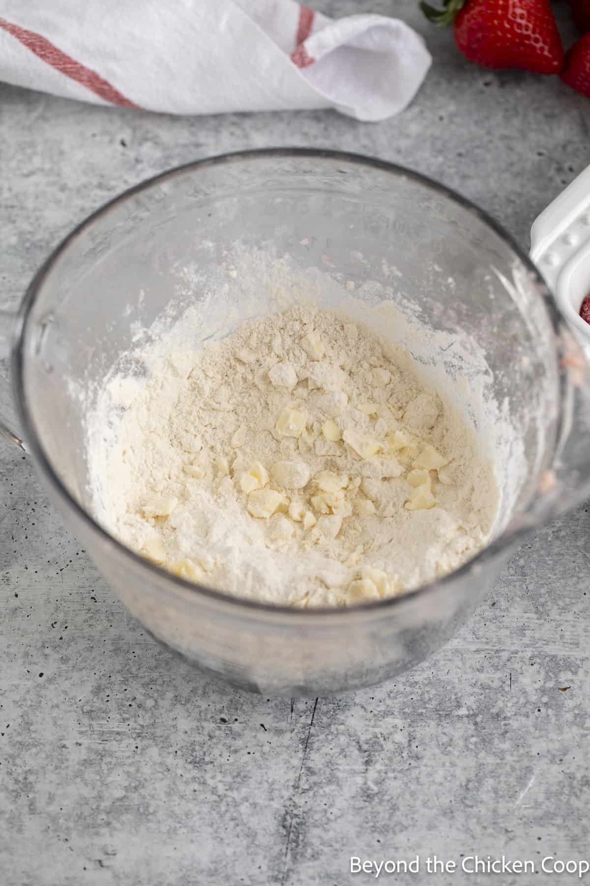Flour and butter in a glass dish.
