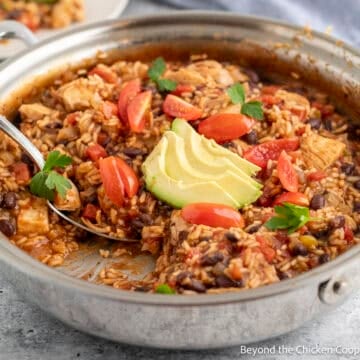 A skillet filled with Mexican Chicken and Rice.