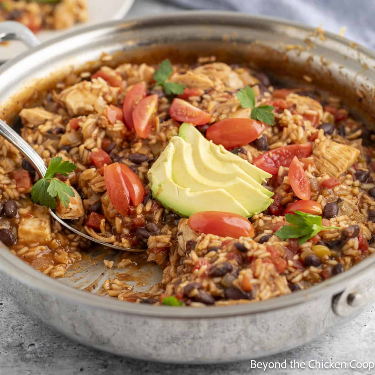 A skillet filled with Mexican Chicken and Rice.
