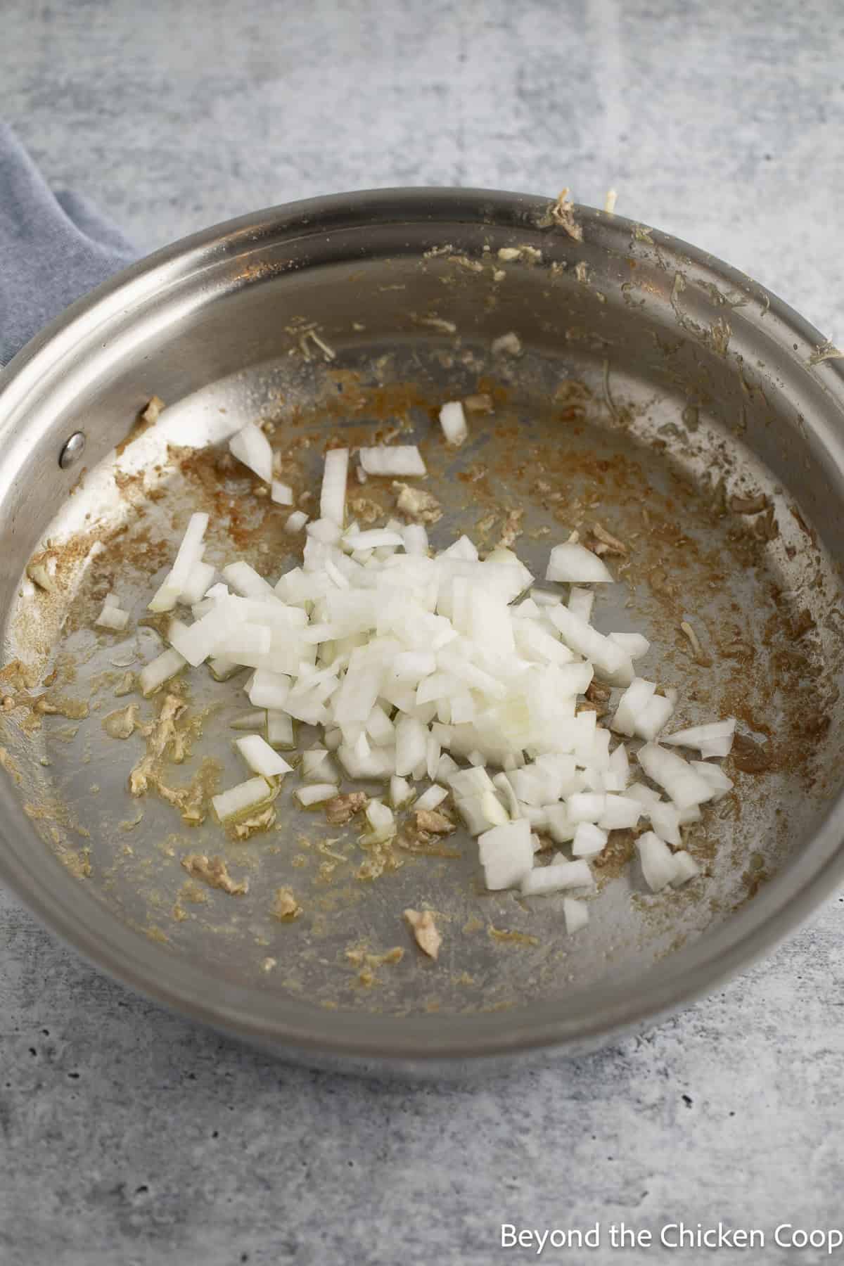 Chopped onions in a skillet.