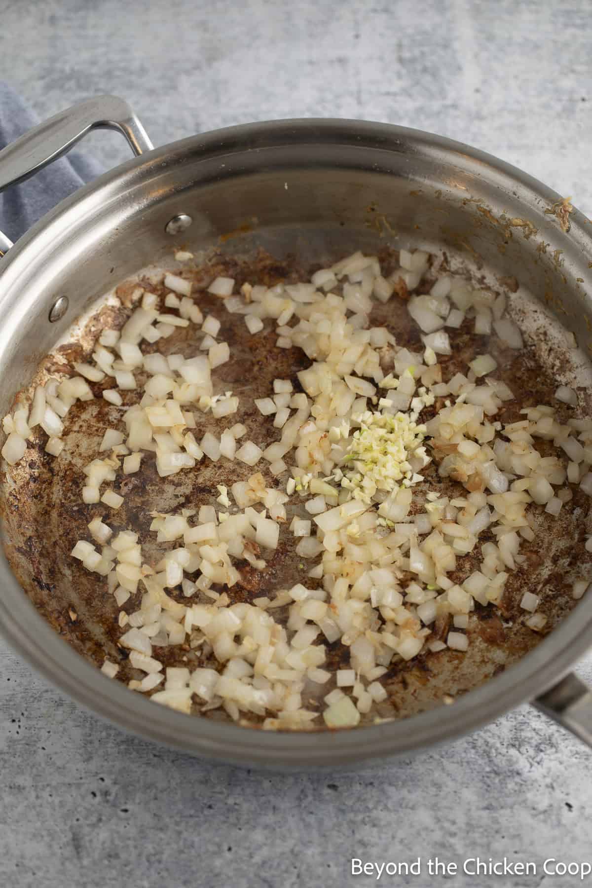 Browned onions in a skillet.