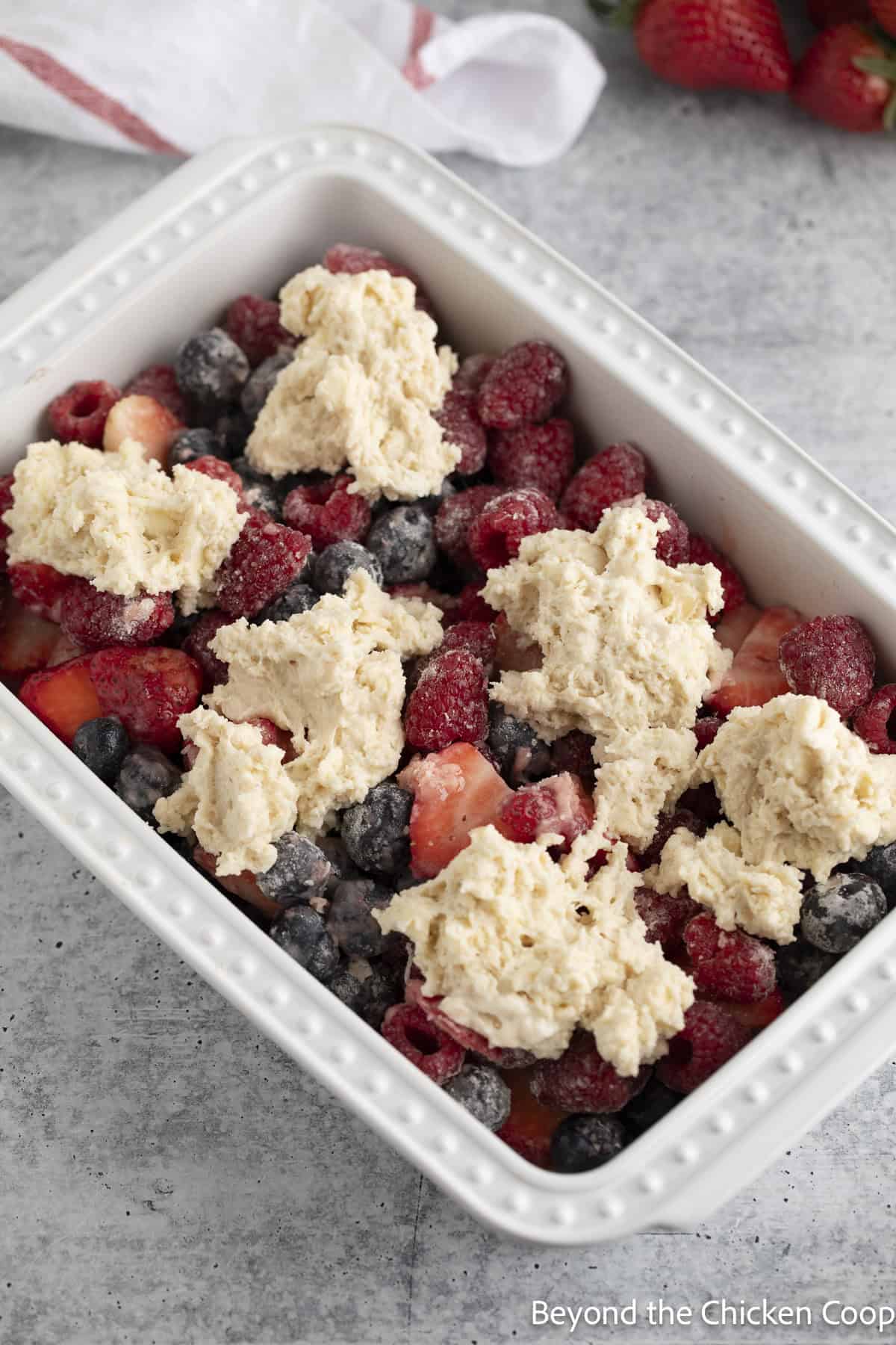 Cobbler batter on fresh berries.