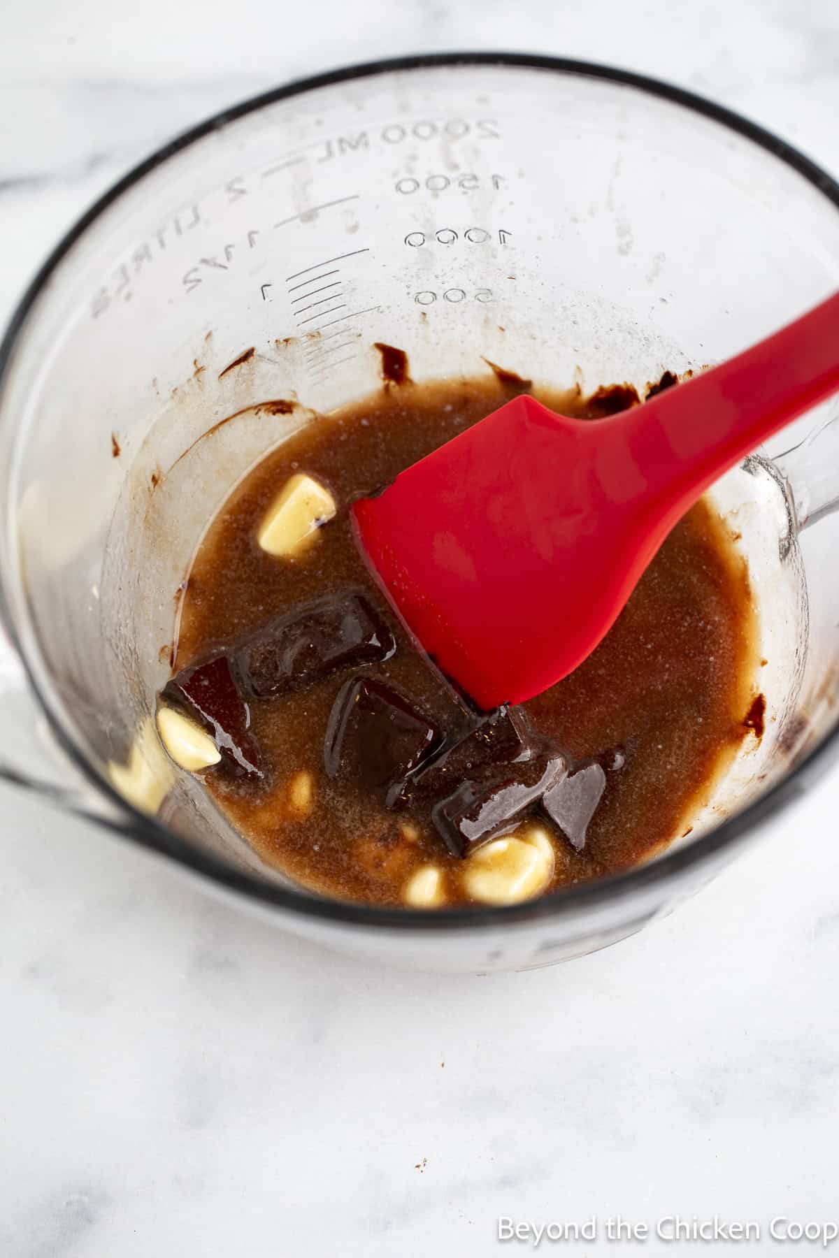 Melted chocolate and butter in a glass bowl.