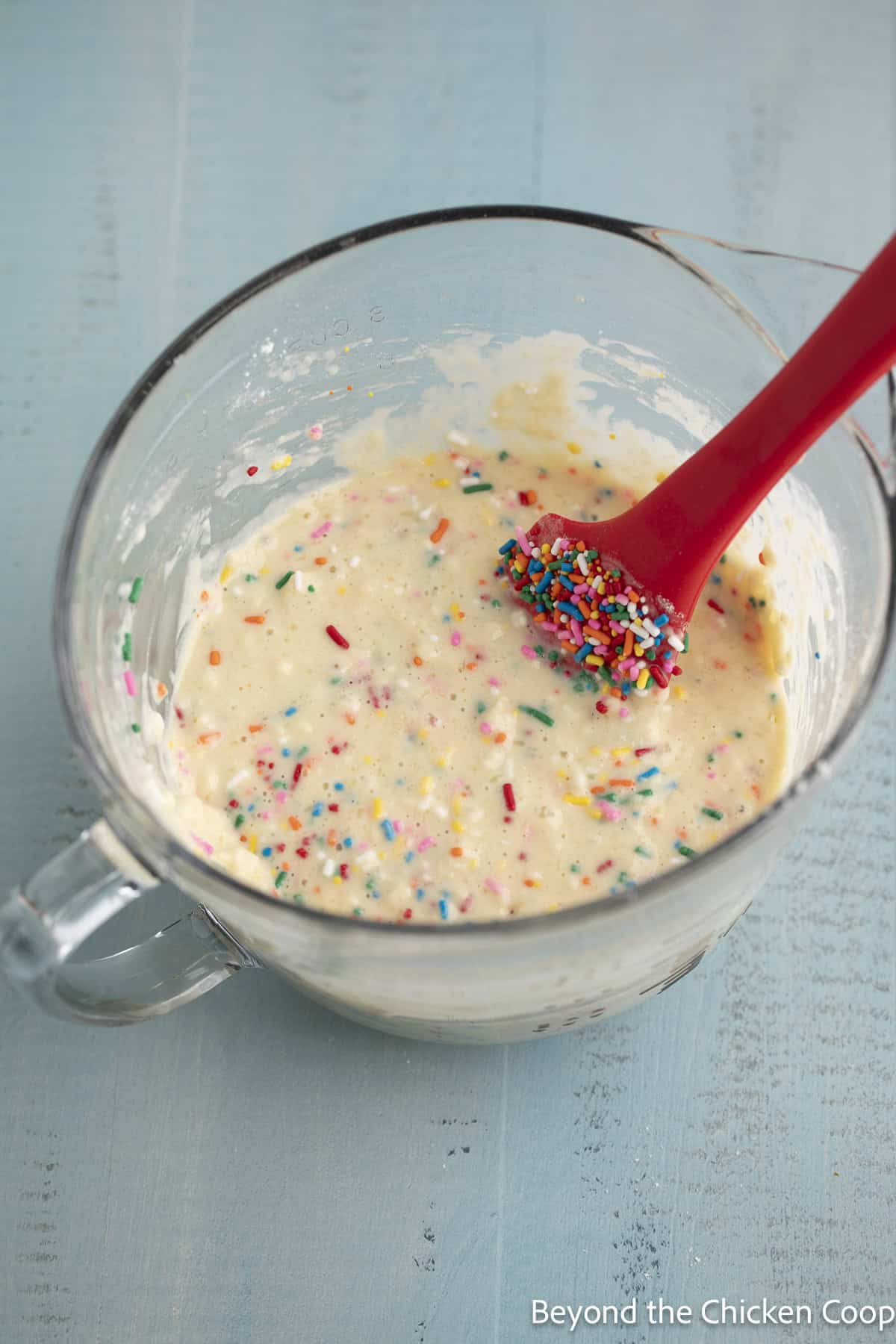Funfetti pancake batter in a glass bowl.