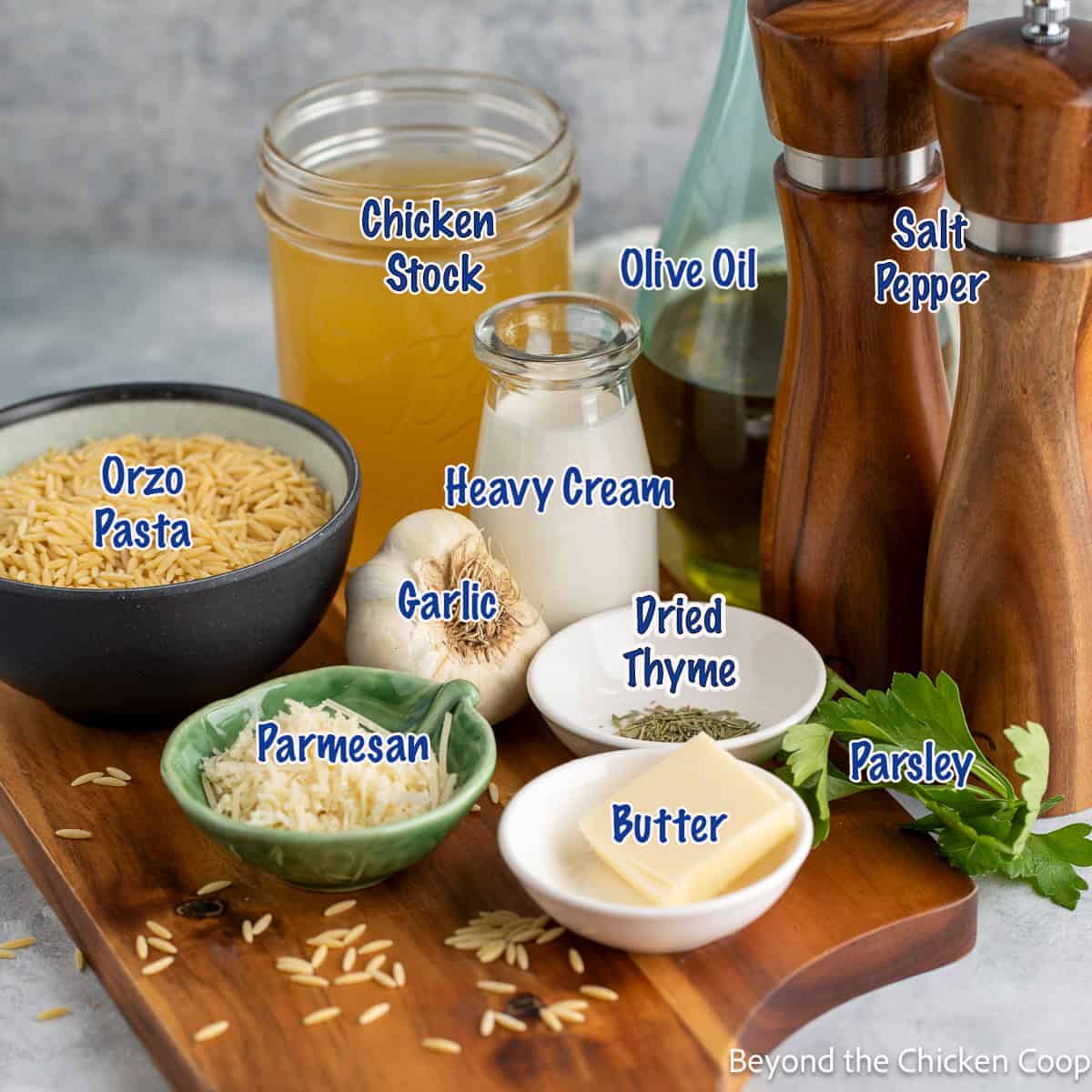 Small bowls filled with ingredients for making orzo pasta.
