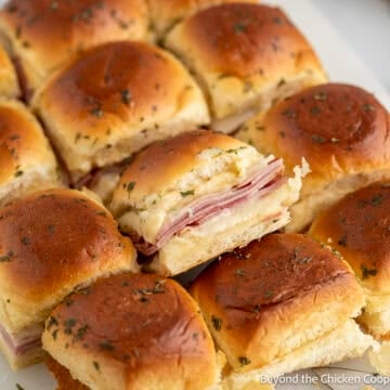 Ham and Cheese Sliders on a cutting board.