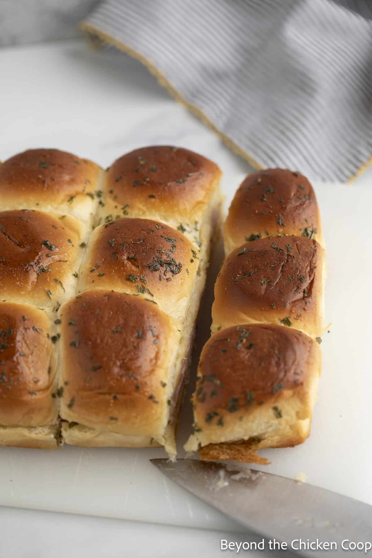 Slicing sliders into individual buns.