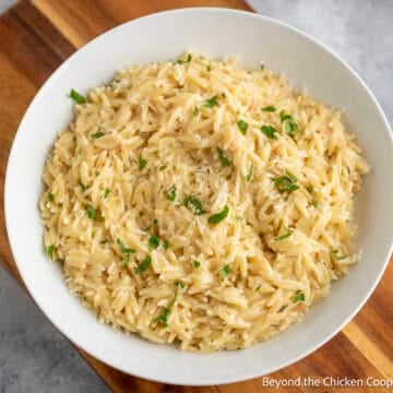 Creamy Orzo Pasta in a white bowl.