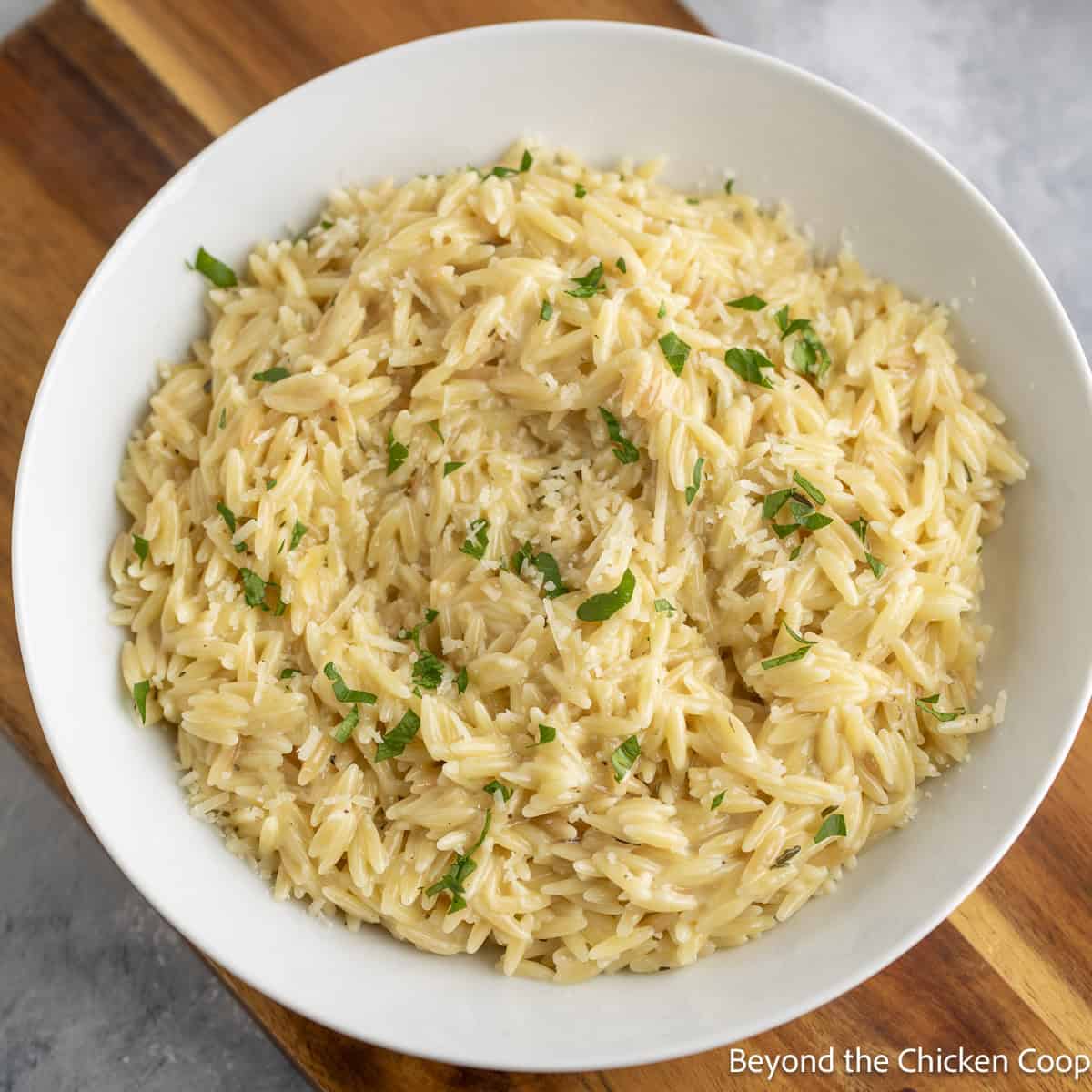 Creamy Orzo Pasta in a white bowl. 