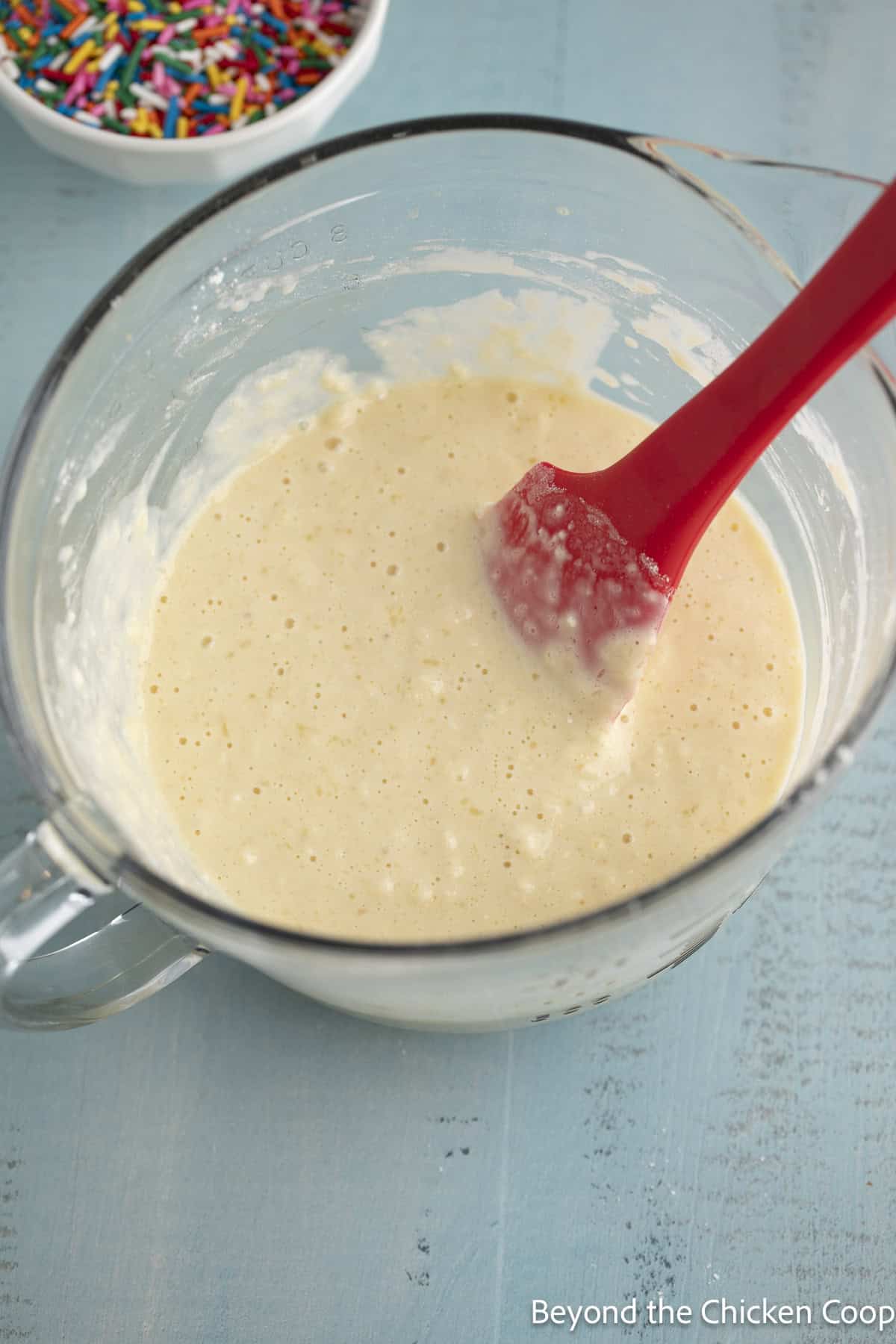 Pancake batter in a glass bowl.