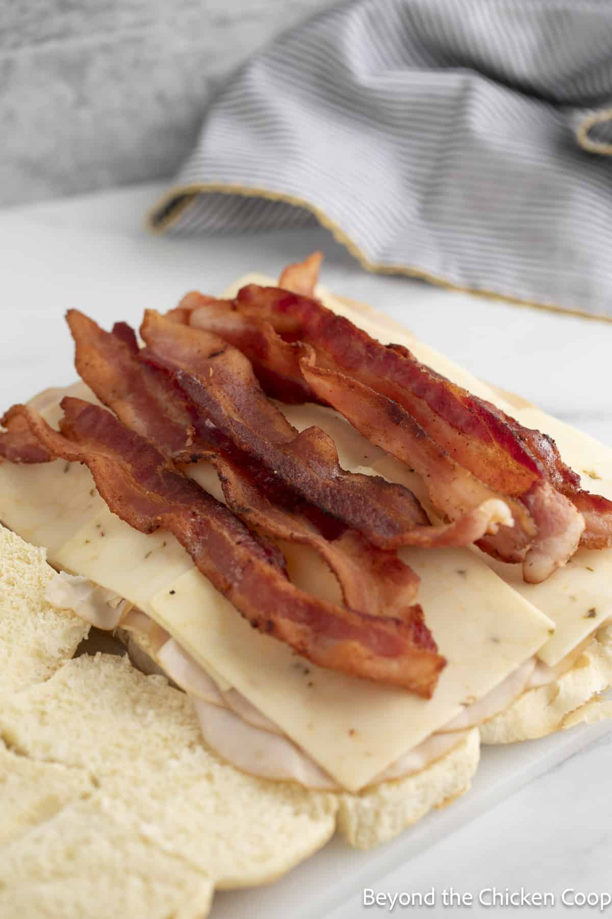 Crispy bacon layered on top of cheese and turkey.