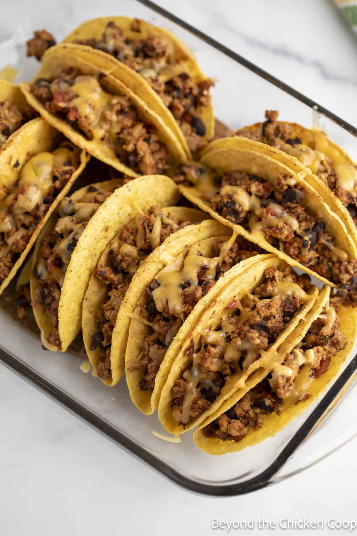 Taco shells filled with ground turkey, black beans, and cheese.